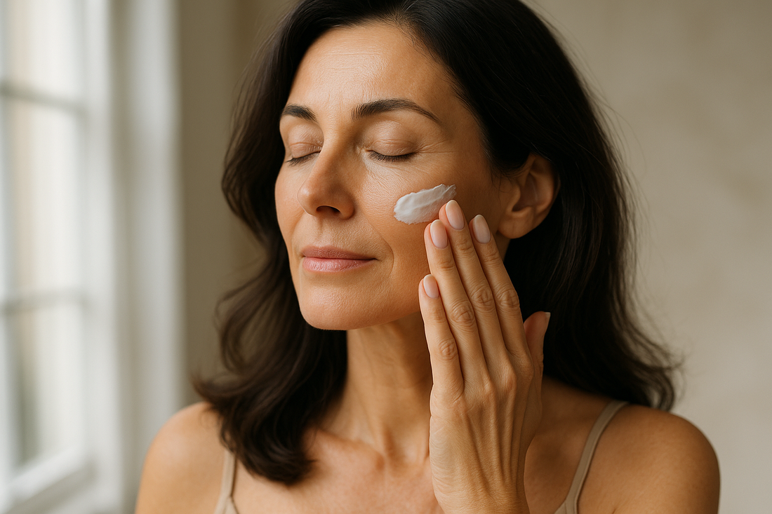 Mature woman applying estriol face cream for menopause skincare